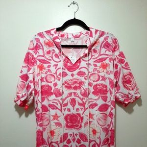 Floor length dress. White with pink flowers and white tassels.